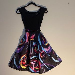 Black dress 4P. top multi colored bottom with wide flare and large side pockets